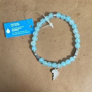 NWT • Aqua Beaded Stretch Bracelet with Silver Wing Charm